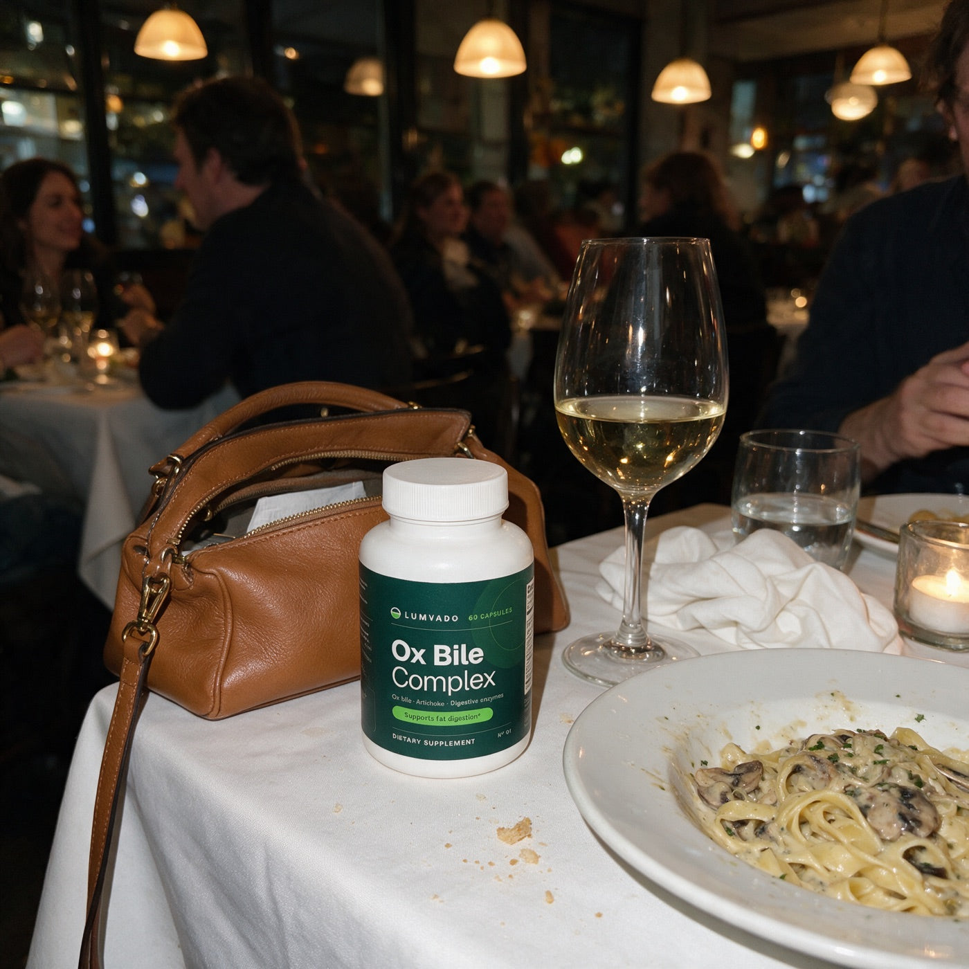 The bottle beside a handbag at a restaurant dinner